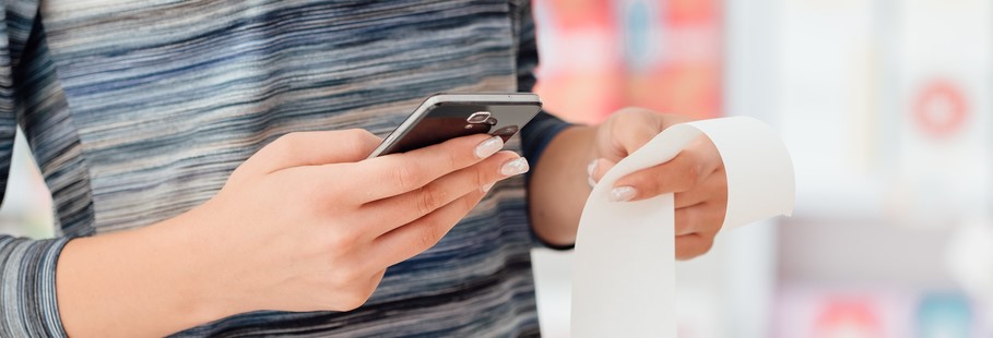 person holding receipt